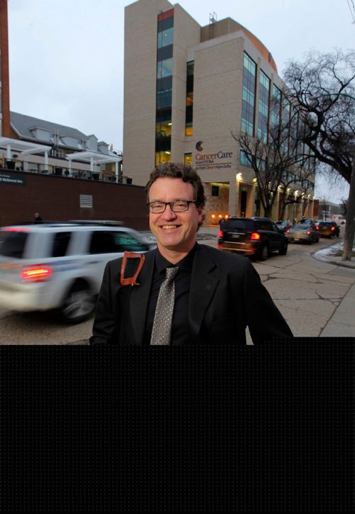 BORIS MINKEVICH / WINNIPEG FREE PRESS
Mobile Notary Public Service owner lawyer Kyle Soble takes a minute to pose for a photo across from HSC CancerCare Manitoba (675 McDermot Avenue) where he helps clients regularly. **His car was parked in the parkade several blocks away and he was going back into CancerCare Manitoba for more appointments**. Rebecca Dahl story. Dec. 1, 2016