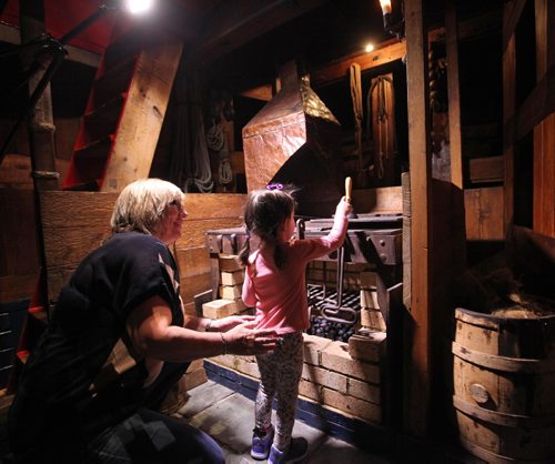 RUTH BONNEVILLE / WINNIPEG FREE PRESS


21/2 year-old Stella Behrendt gets a sneak peek with her Grandmother, Charlene Slingsby, below the Nonsuch at the Manitoba Museum into the mysterious cargo hold area below the deck of the boat.  It  houses not only the ships stove used for cooking and heat during that maiden voyage to James Bay but also bunk areas for the crew.  The Christmas season is  the one time of year it is open for tours  to the public to climb down below the deck of the replica of the 17th-century ship that sailed to Hudson Bay in 1668 in the first trading voyage for what was to become the Hudson's Bay Company two years later.  The museum tours take place Saturdays and Sundays in December and every day throughout the winter holiday between 1:00 and 4:00 pm.
Standup photo 
Dec 1, 2016

