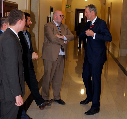 BORIS MINKEVICH / WINNIPEG FREE PRESS
Premier of Manitoba Brian Pallister, right, talks to some PC party aids for a second right after leaving the house after question period at the Manitoba Legislature today. Everyone is happy they are off for xmas. Dec. 2, 2016