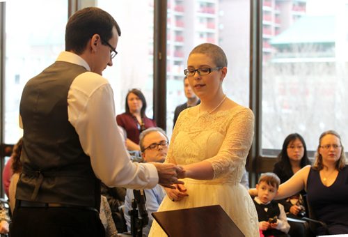 RUTH BONNEVILLE / WINNIPEG FREE PRESS

Chris Herie and his partner Lisa share vows, rings and a kiss as they are married at City Hall Friday afternoon.  They are the first couple to be married in a civil ceremony at City Hall.  Their children. son - Tiernan, 5yrs, and daughter - Dahlia, 2yrs, were in the wedding party with friends, family and the media there to capture the moments event.  
See Jen Zoratti's story.  
Dec 2, 2016

