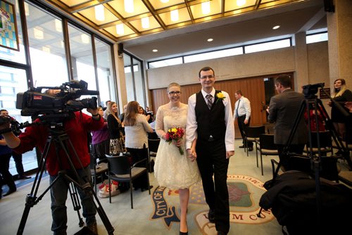 RUTH BONNEVILLE / WINNIPEG FREE PRESS

Chris Herie and his partner Lisa walk together hand in hand after sharing their vows at City Hall Friday afternoon.  They are the first couple to be married in a civil ceremony at City Hall.  Their children. son - Tiernan, 5yrs, and daughter - Dahlia, 2yrs, were in the wedding party with friends, family and the media there to capture the moments event.  
See Jen Zoratti's story.  
Dec 2, 2016
