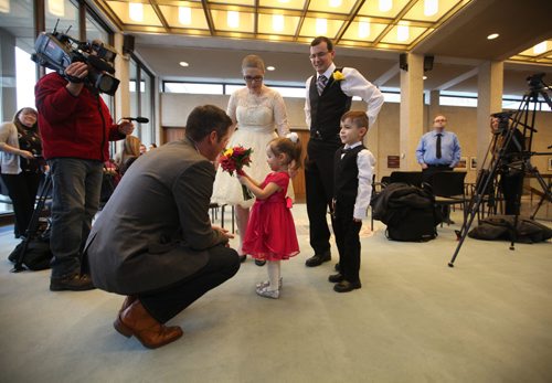 RUTH BONNEVILLE / WINNIPEG FREE PRESS

Chris and Lisa Herie with their kids son - Tiernan, 5yrs, and daughter - Dahlia, 2yrs chat with Winnipeg Mayor Brian Bowman after their marriage at City hall on Friday afternoon.  They are the first couple to be married in a civil ceremony at City Hall with friends, family, mayor Brian Bowman and the media there to capture the moments event.  
See Jen Zoratti's story.  
Dec 2, 2016
