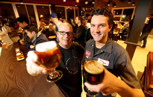 TREVOR HAGAN / WINNIPEG FREE PRESSFrom left, Dave Rudge, owner and Chris Young, brewmaster, inside the new tap room at Half Pints Brewery, Saturday, December 3, 2016. For Ben column