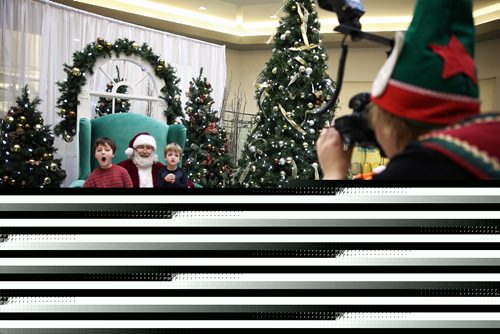 MIKE DEAL / WINNIPEG FREE PRESS

(From left) Evan Boszko, 8 and his brother Zackary, 4 sit with Santa for a photo at Grant Park Mall Sunday morning. 
The Autism Society Manitoba provided a Sensitive Santa event for families who have a children with autism. The event was set up to accommodate children and teens that are unable to attend a typical Santa event due to sensory challenges. 

161204
Sunday, December 04, 2016