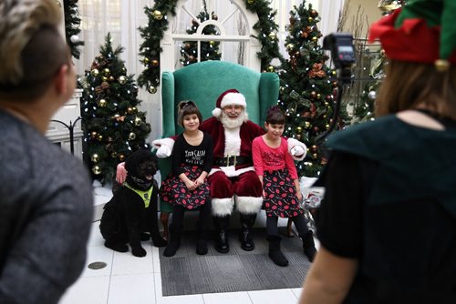 MIKE DEAL / WINNIPEG FREE PRESS

(From left) Eight-year-old twins Signey and Jorja along with service dog Scottie sit with Santa for a photo at Grant Park Mall Sunday morning. 
The Autism Society Manitoba provided a Sensitive Santa event for families who have a children with autism. The event was set up to accommodate children and teens that are unable to attend a typical Santa event due to sensory challenges. 

161204
Sunday, December 04, 2016