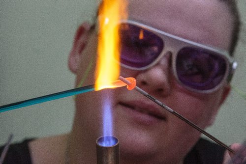 MIKE DEAL / WINNIPEG FREE PRESS
Ashlyn Noble creates glass beads to sell at her table during the Holiday Geek Market that The Winnipeg Geek Girls Social Club held in the Burns Family Classroom located in the Art Space Building in Winnipeg's Exchange District Sunday.
161204 - Sunday, December 4, 2016.