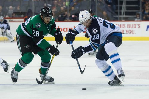 MIKE DEAL / WINNIPEG FREE PRESS
Manitoba Moose' Patrice Cormier (28) tries to keep control of the puck against Texas Stars' Matej Stransky (28) during an AHL game at the MTS Centre Sunday afternoon.
161204 - Sunday, December 4, 2016.