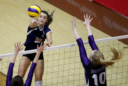 TREVOR HAGAN / WINNIPEG FREE PRESS
St.Mary's Academy Flames Jenna Cross hits through the block of Brandon's Vincent Massey Vikings. St. Mary's would go on to win the High School Volleyball Championship, Monday, December 5, 2016.