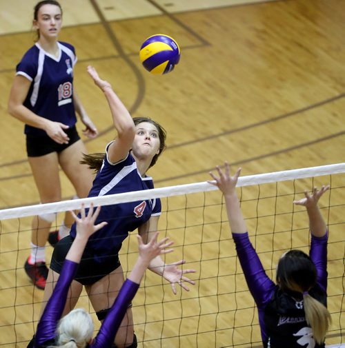 TREVOR HAGAN / WINNIPEG FREE PRESS
St.Mary's Academy Flames Taylor Boughton hits over Brandon's Vincent Massey Vikings. St. Mary's would go on to win the High School Volleyball Championship, Monday, December 5, 2016.