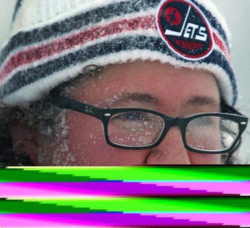 JOE BRYKSA / WINNIPEG FREE PRESS Rayna Tolchinsky braves the snow in River Heights in  Winnipeg  The city and southern Manitoba will have winter storm/ blizzard conditions for the day-  Dec 06, 2016 -( standup Photo)