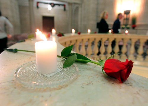 BORIS MINKEVICH / WINNIPEG FREE PRESS
Sunrise Memorial - National Day of Remembrance and Action on Violence Against Women. The event honoured the memory of the 14 young women killed in the Montreal Massacre in 1989 and women in Manitoba who have died as a result of violence in 2016. Photo taken in the Manitoba Legislative Building Rotunda. 14 candles and 14 roses lay on the rotunda area. Dec. 6, 2016