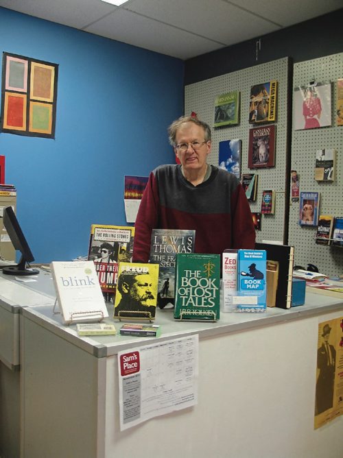 Canstar Community News Nov. 28, 2016 - ZED Books owner Barry Gibson behind the counter of the store's new location at 213 Hespeler Avenue. (SHELDON BIRNIE/CANSTAR/THE HERALD)