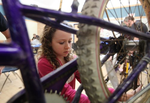 RUTH BONNEVILLE / WINNIPEG FREE PRESS

Sophie Lemoine - 9yrs, works on a bike during Cycle of Giving marathon Saturday.   She was just one of hundreds of volunteer mechanics and helpers of all ages that converged on Rossbrook House during  a 24 hour kids bike building marathon event.  The goal: to turn trailers full of kids bikes recuperated from the Brady landfill into 350+ holiday presents for kids in need, all the while hoping to raise $15,000 to provide bicycle programming for Winnipeg youth throughout the year.
See story.

 Dec 10, 2016
