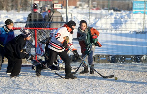 RUTH BONNEVILLE / WINNIPEG FREE PRESS

Kids raise money in support of refugees while having fun playing street hockey during the  Breakaway Street Hockey Classic in the parking lot of Grant Memorial Church Saturday.  Funds raised goes to support Hospitality House.

Standup photo
 Dec 10, 2016