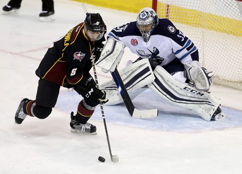 TREVOR HAGAN / WINNIPEG FREE PRESS
Cleveland Monsters Aaron Palushaj (8) got the puck alone in front of Manitoba Moose goaltender Ondrej Pavelec (31) but couldn't score during second period AHL action, Saturday, December 10, 2016.