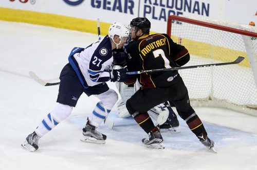 TREVOR HAGAN / WINNIPEG FREE PRESS
Manitoba Moose Kevin Czucman (27) tries to clear Cleveland Monsters Nick Moutrey (7) from in front of goaltender Ondrej Pavelec (31) during second period AHL action, Saturday, December 10, 2016.