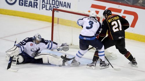 TREVOR HAGAN / WINNIPEG FREE PRESS
Manitoba Moose goaltender Ondrej Pavelec (31) stretches out to stop Cleveland Monsters Paul Bittner (21) as he battles with Jan Kostalek (3) in front of the net during second period AHL action, Saturday, December 10, 2016.