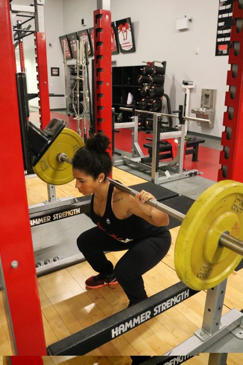 Canstar Community News Desiree Scott does some wheight squats at NRG Athletes Therapy Fitness on Dec. 8, 2016.