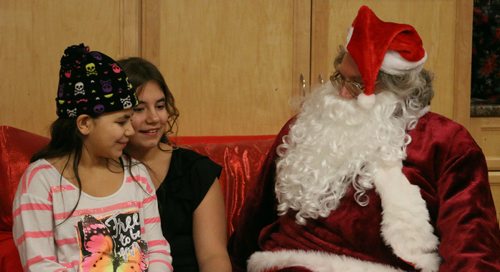 Canstar Community News Small children, teenagers, and families got to visit Santa at LUTA on Selkrik Avenue. / Photo by Christina