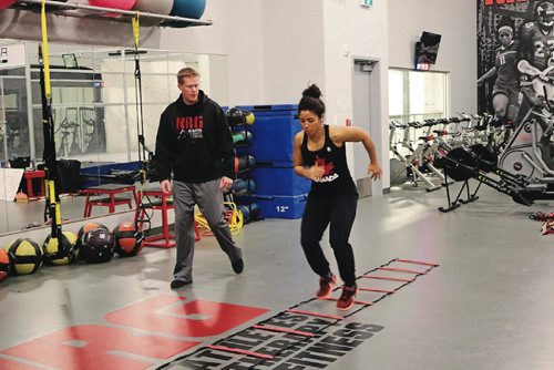 Canstar Community News Desiree Scott does some ladder workout at NRG Athletes Therapy Fitness on Dec. 8, 2016.