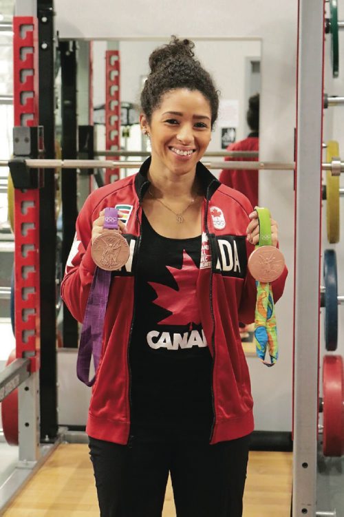 Canstar Community News Canadas soccer player Desiree Scott holds her two bronze medals on Dec. 8, 2016.