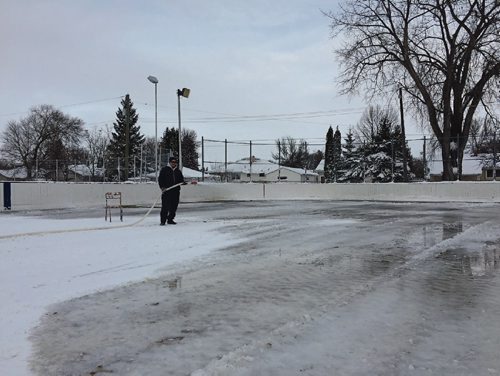 Canstar Community News Dec. 8, 2016 - After clearing a heavy snowfall, icemaker Terry Stafekis begins flooding the first of North Kildonan Community Centre's four skating rinks. Stafekis said Dec. 8 is the latest he's ever started flooding in the 33 years he's been doing the NKCC rinks. (SHELDON BIRNIE/CANSTAR/THE HERALD)