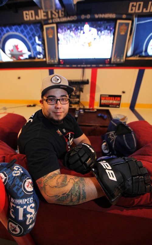 PHIL HOSSACK / WINNIPEG FREE PRESS -   Kyle Calder, who has converted his basement into the second coming of the MTS Centre; lines painted on the floor... hockey boards as walls... TV as game clock etc etc Dave Sanderson story.  - December 13, 2016