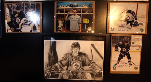 PHIL HOSSACK / WINNIPEG FREE PRESS -  Posters, photos and other memoribilia cover the walls.  Kyle Calder, who has converted his basement into the second coming of the MTS Centre; lines painted on the floor... hockey boards as walls... TV as game clock etc etc Dave Sanderson story.  - December 13, 2016