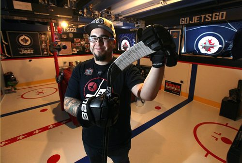 PHIL HOSSACK / WINNIPEG FREE PRESS - Kyle Calder, who has converted his basement into the second coming of the MTS Centre; lines painted on the floor... hockey boards as walls... TV as game clock etc etc Dave Sanderson story.  - December 13, 2016