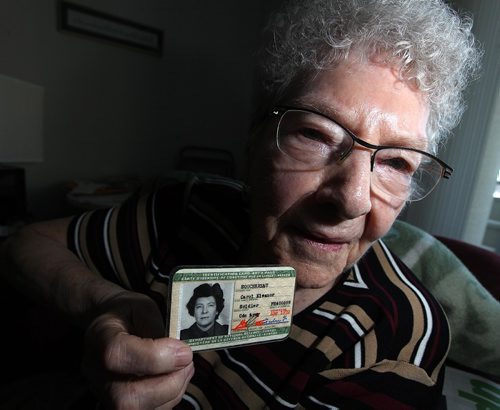 PHIL HOSSACK / WINNIPEG FREE PRESS - Carely Thomson shows her military ID, she served as a peacekeeper after WW2, her husband Ian flew Halifax Bombers in WW2. See Kevin Rollason's story. December 15, 2016