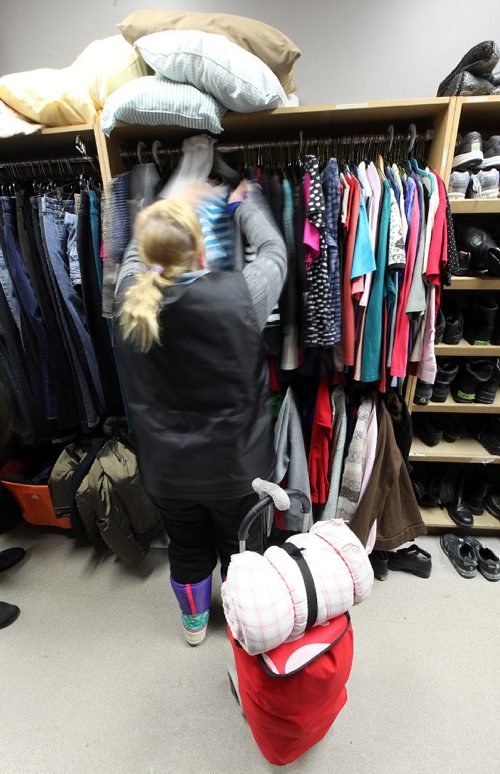 PHIL HOSSACK / WINNIPEG FREE PRESS -  "Anonymous1" sifts through clothing available to the homeless at Silom Mission Thursday. See Jenn Zorati's story re: Homeless......   - December 15, 2016