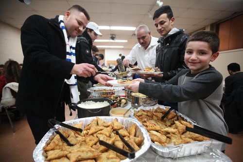 RUTH BONNEVILLE / WINNIPEG FREE PRESS

Six-year-old Maher Hassan from the local Yazido community is all smiles as he has his plate filled up with homemade, traditional Yazidi dishes during feast in celebration of Eida Rojia, the end of their three-day Decemnber fast at Temple Shalom Friday evening.  They are also celebrating the good news they just received that two more Yazidi refugee families will arrive in Winnipeg next week.
See Carol Sanders story.   


 Dec 16, 2016