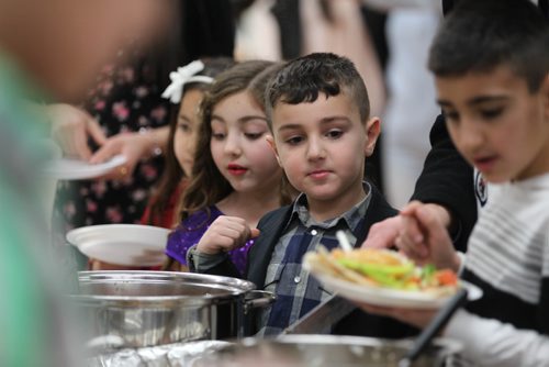 RUTH BONNEVILLE / WINNIPEG FREE PRESS

Local kids from the  Yazido community fill their plates with homemade, traditional Yazidi dishes during feast in celebration of Eida Rojia, the end of their three-day Decemnber fast at Temple Shalom Friday evening.  They are also celebrating the good news they just received that two more Yazidi refugee families will arrive in Winnipeg next week.
See Carol Sanders story.   


 Dec 16, 2016
