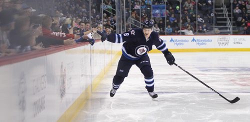 
RUTH BONNEVILLE / WINNIPEG FREE PRESS

Jacob Trouba #9 competes in the  fastest skater event while slapping fans hands in the stands at MTS Centre Friday night.   


 Dec 16, 2016