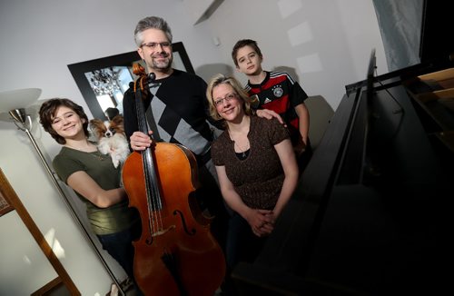 TREVOR HAGAN / WINNIPEG FREE PRESS
Yuri Hooker, WSO principal cellist, his wife, Michelle Mourre, a conductor/pianist and their daughter, Elly, 14, son, Ari, 12 and dog, Pippin, Saturday, December 17, 2016.