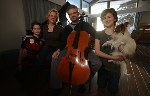 TREVOR HAGAN / WINNIPEG FREE PRESS
Yuri Hooker, WSO principal cellist, his wife, Michelle Mourre, a conductor/pianist and their son, Ari, 12, daughter, Elly, 14 and dog, Pippin, Saturday, December 17, 2016.