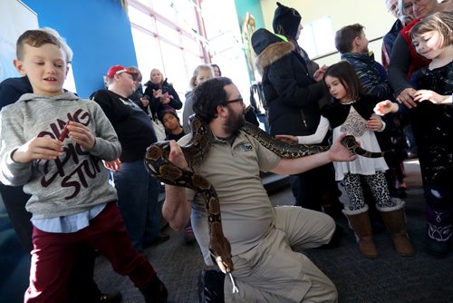 TREVOR HAGAN / WINNIPEG FREE PRESS
Shane Pratt, an animal care supervisor from the Assiniboine Park Zoo shows "Tails" an approximately 7 foot long red tailed boa constrictor to an excited group of kids who were watching The Jungle Book at the MTYP, Saturday, December 17, 2016.