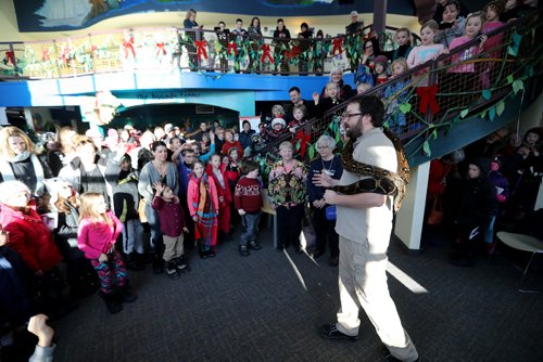 TREVOR HAGAN / WINNIPEG FREE PRESS
Shane Pratt, an animal care supervisor from the Assiniboine Park Zoo shows "Tails" an approximately 7 foot long red tailed boa constrictor to an excited group of kids who were watching The Jungle Book at the MTYP, Saturday, December 17, 2016.