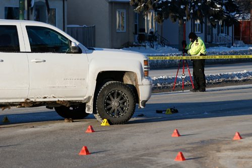 JOHN WOODS / WINNIPEG FREE PRESS
Police investigate at the scene of a pedestrian MVC at the intersection of Henderson and Kimberly Sunday, December 18, 2016. A woman was taken to hospital in critical condition.

