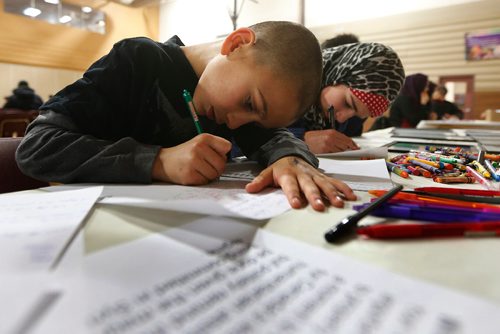 JOHN WOODS / WINNIPEG FREE PRESS
Kemiee Kasas and other children write letters to Prime Minister Trudeau at "A Community Conversation on Aleppo" at the Waverley Grand Mosque Sunday, December 18, 2016.