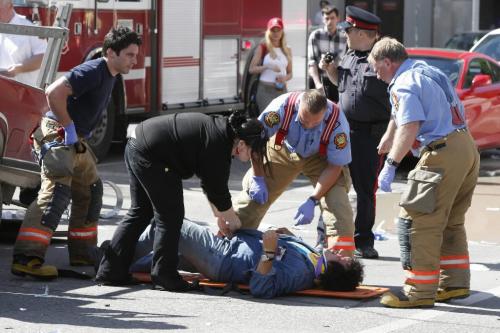 WINNIPEG, MAN: JUNE 25, 2008 -- Fire crews work on one of the victims of a car crash that killed two and sent another three to the hospital in Winnipeg, Man. June 25, 2008. Accident happened at Donald Street and St. Mary Ave at 4:20pm.  BORIS MINKEVICH / WINNIPEG FREE PRESS