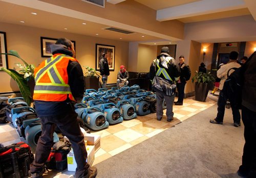 BORIS MINKEVICH / WINNIPEG FREE PRESS
BREAKING NEWS - Chateau 100 apartments at 72 Donald was flooded early this morning. Flood restoration crews are on scene. ASHLEY PREST STORY. Dozens of fans for drying and crew marshal in the lobby of the apartment high rise. Dec. 19, 2016