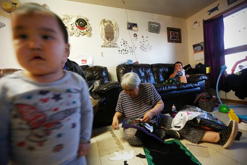 JOHN WOODS / WINNIPEG FREE PRESS
Wall hanging artist Fanny Avatituq photographed with her grandchildren Desiree and Mike at her home in Baker Lake September 23, 2016
