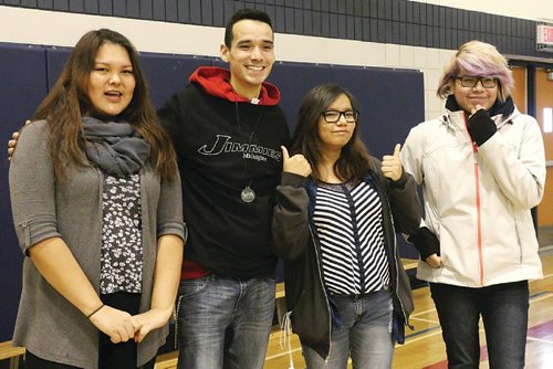 Canstar Community News St. James Collegiate sudents get a chance to meet with activist and public speaker Michael Champagne on Dec. 13. From left to right: Melissa Labbott Ottertail, 17, Michael Champagne, Renée Daniles, 17, and Farron Okmeow, 17.
