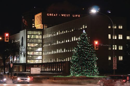 Canstar Community News Don Kubaras blue spruce tree serves as a Christmas tree at Great West Life on Broadway and Osborne Street on Dec. 14, 2016.