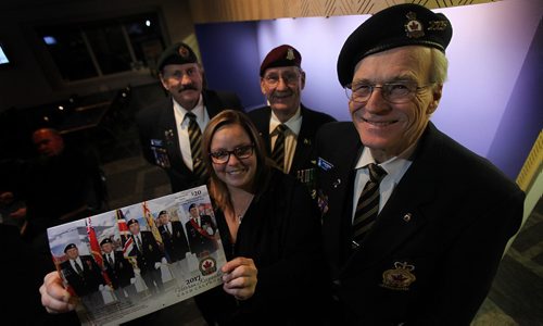 PHIL HOSSACK / WINNIPEG FREE PRESS -  Left to right, Claude Gagnon, Nicole Fanshaw, Al Mills and Gordon Machej  (president) pose at of Royal Cdn Legion Henderson Highway Branch 215. The legion is selling calendars to fundraise and build a memorial wall at their club room. See Kevin Rollason's story.  - December 21, 2016