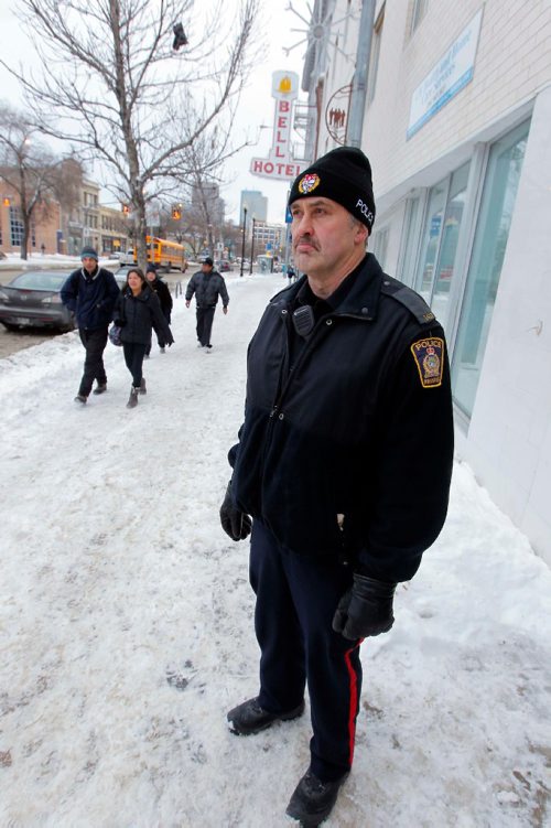 BORIS MINKEVICH / WINNIPEG FREE PRESS
Winnipeg Police Service Main St. beat cop Kevin Burkett poses for a photo on Main Street south of Logan Ave.  Dec. 21, 2016