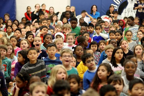 TREVOR HAGAN / WINNIPEG FREE PRESS
Excited students at Bonnycastle School look to see weight totals as the donated over 2400lbs of food to Winnipeg Harvest, surpassing the combined weight of Bob Toogood, Chris Walby, Jermese Jones and Chris Thorburn, Thursday, December 22, 2016.