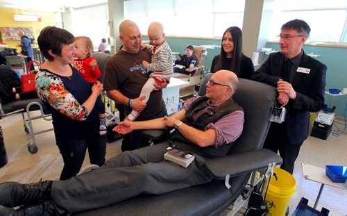 BORIS MINKEVICH / WINNIPEG FREE PRESS
The Dream Factory joined Canadian Blood Services at the Winnipeg blood donor clinic, 777 William, to thank donors and remind people to take the time to give life by donating blood this holiday season. The family of four-year-old Paisley, who has received blood in her battle with a brain tumor and is a Dream Kid, was on hand to thank donors for their life saving gift. L-R Paisley's family- Mother Amy Millette holding son Kivor Amyotte(20 month old), Maurice Amyotte holding Paisley Amyotte(4yrs old), 139 time blood donator Doug Bedford(in lounger seat), Patricia Bal, Territory Manager, Canadian Blood Services, and Howard Koks, Executive Director, The Dream Factory. Dec. 22, 2016
