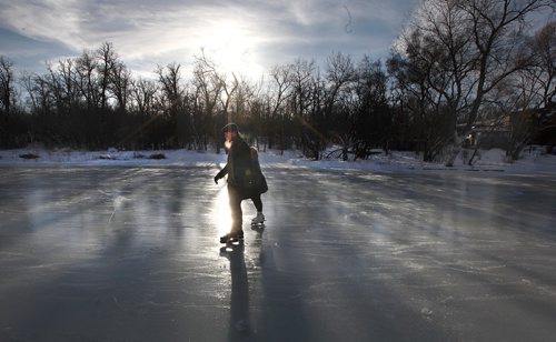 PHIL HOSSACK / WINNIPEG FREE PRESS -  The early bird gets....clean ice!! A pair of skaters enjoy the freshly flooded Duck Pond at Assinaboine Park Thursday afternoon. Park preparations include officially opening ther skating pond and tobogan run to welcone visitors over the holidays.  Starting Friday Kids have free admission at the Zoo as well. (See story / release) - December 20, 2016
